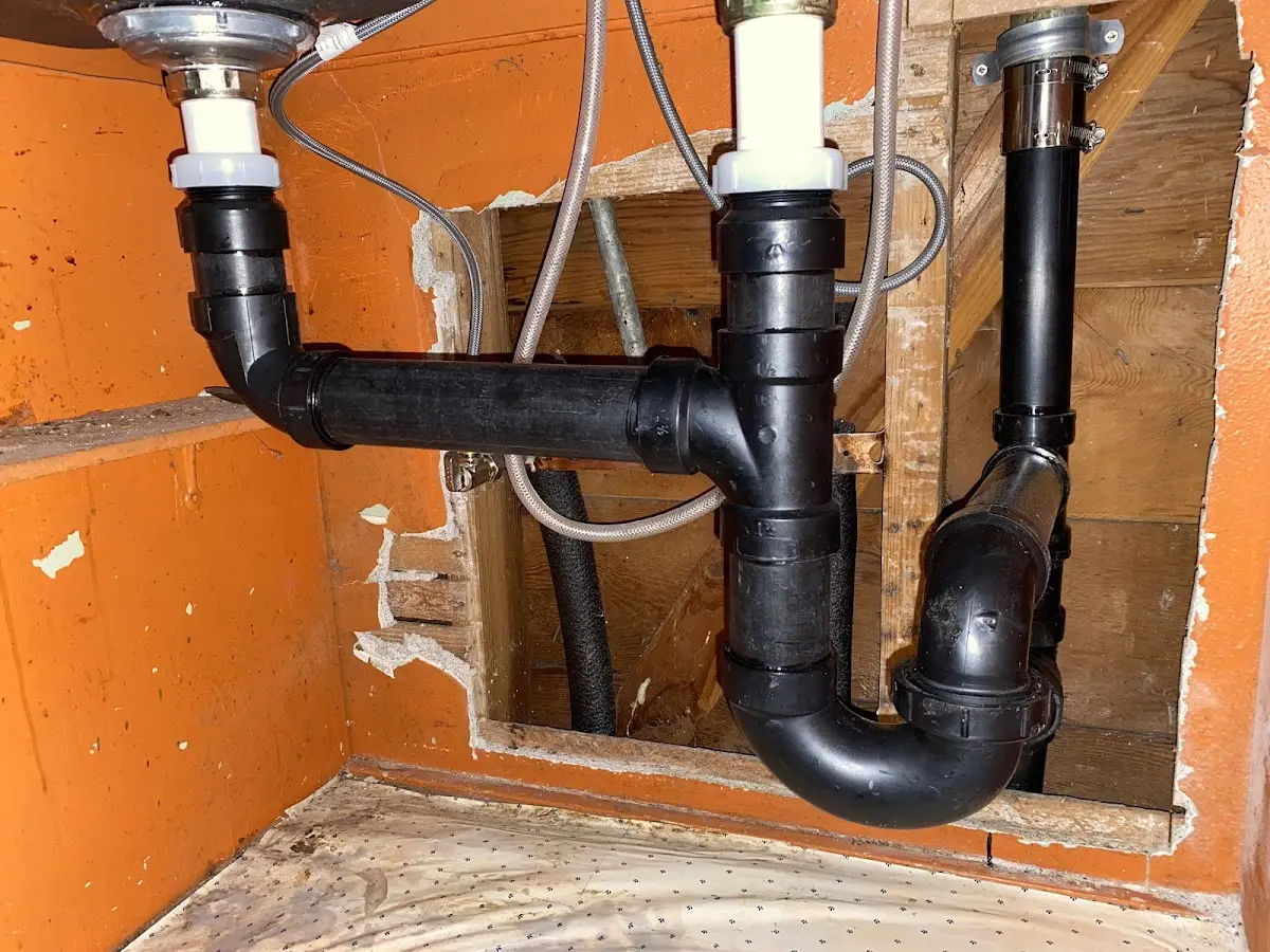 Professional Garbage Disposal Repair equipment and tools on the job in Augusta